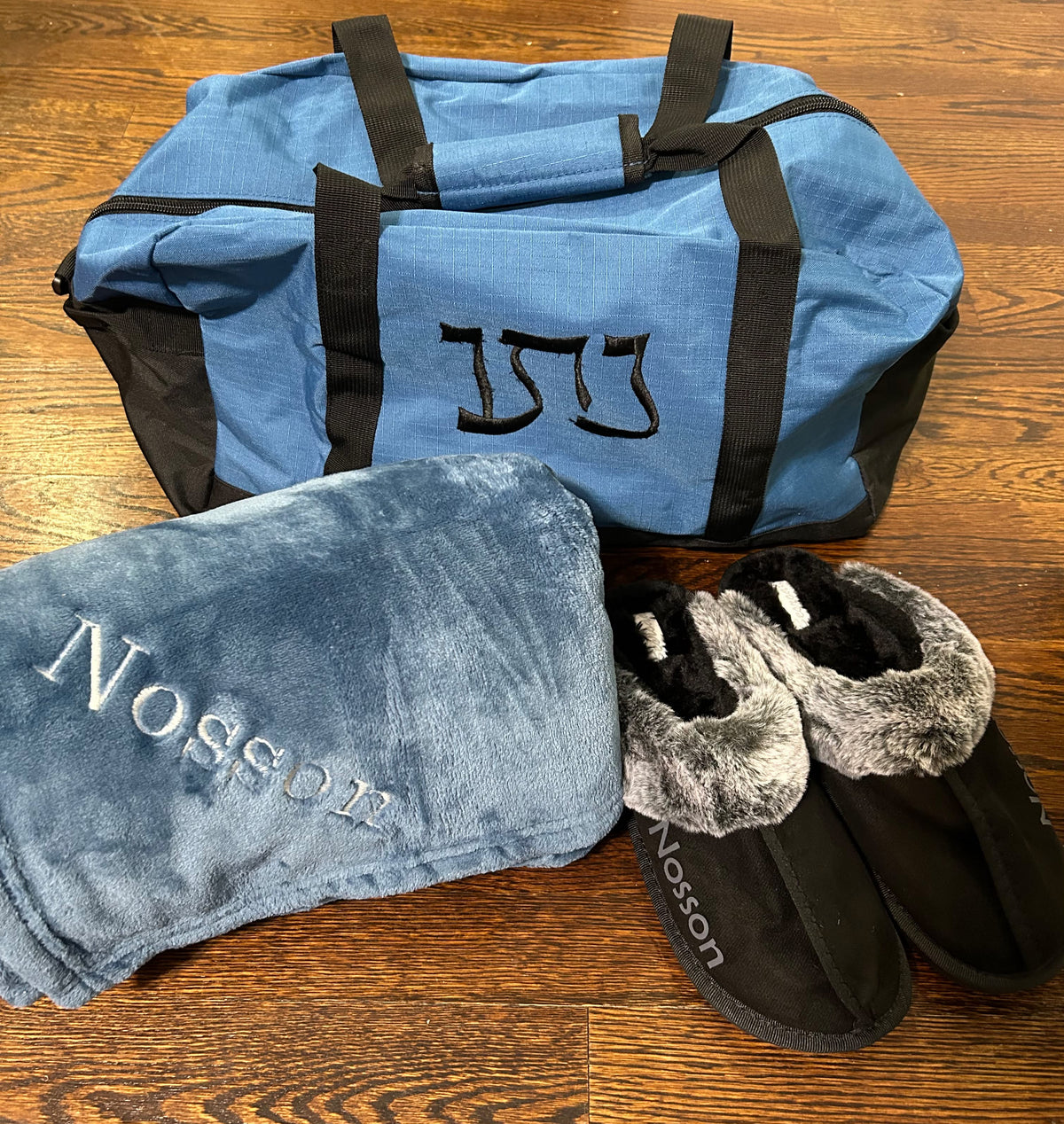 Duffle bag, throw blanket, slippers